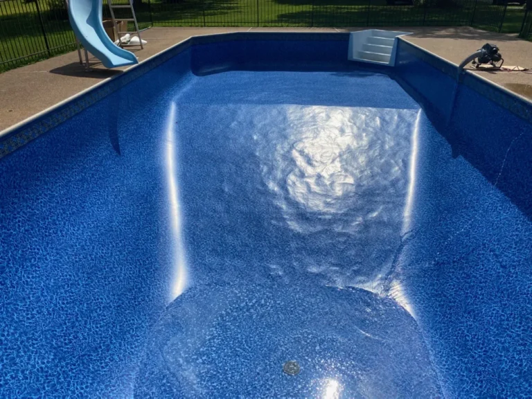 Las Olas pool with slide being filled with water