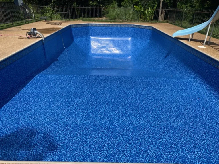 A blue swimming pool with a blue liner.