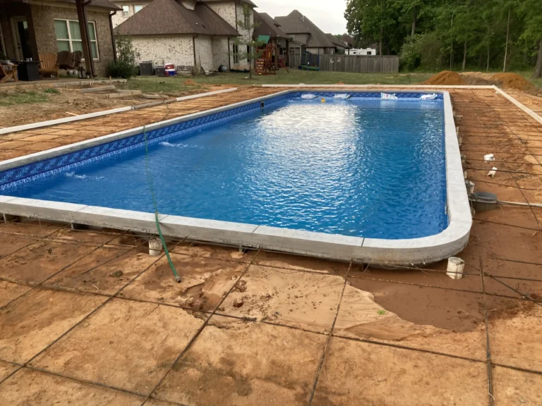 Amelia Silver pool liner filled with water waiting for concrete to be poured around it