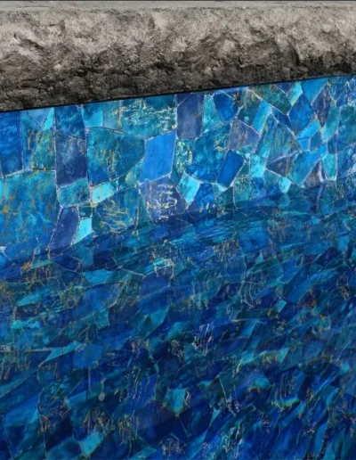 Side of the pool showing the shimmering effects of the gold in the seaglass pattern in the water