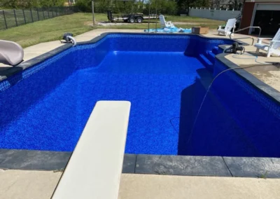 Agra Bahama pool being filled with water that has a diving board and slide