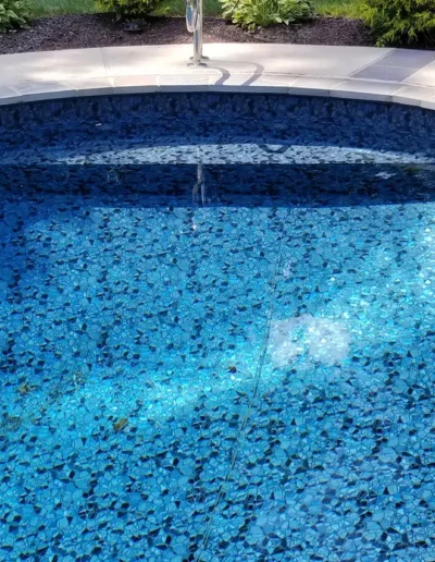 side view of a butterfly effect pattern pool with steps
