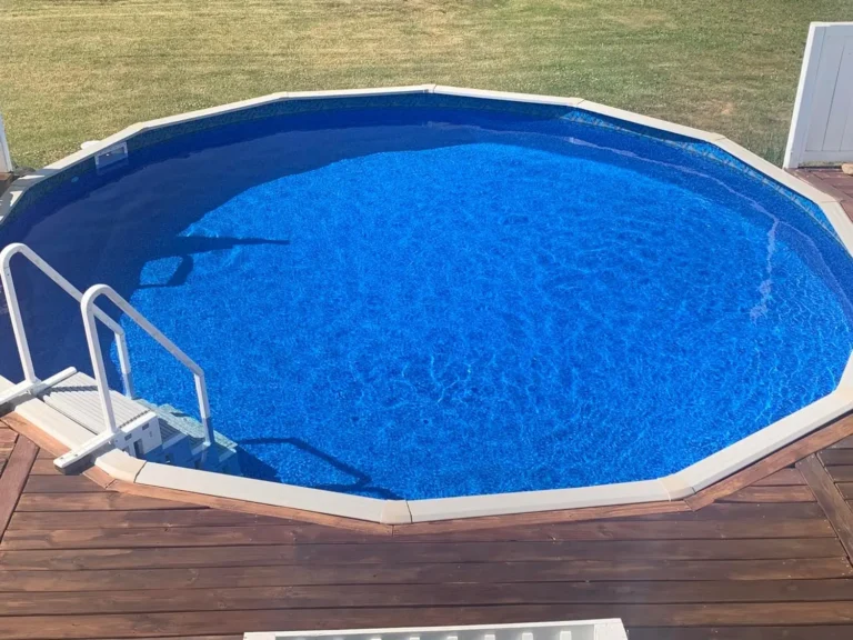 Reef River pattern Above-ground pool with a wooden deck around it