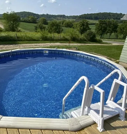 Deck view of a round above-ground pool with the Bayview Slate pool liner pattern from Branded Manufacturing.