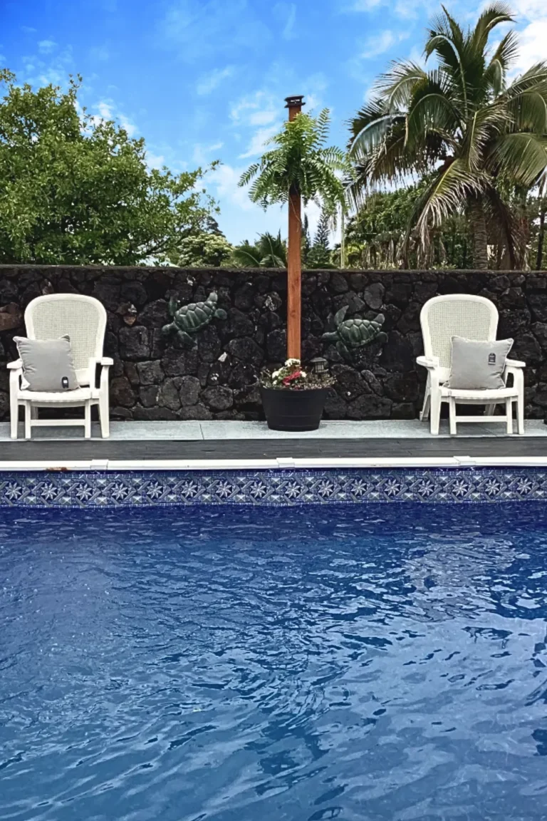 Pool chairs next to an pool with the Evening Star Liner