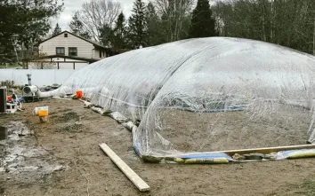 Clear 30'x60' Pool Construction Dome over a pool