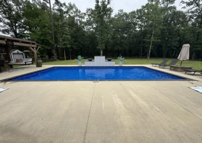 side view of a sports pool with the Santorini All Over liner with water